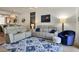 Beautiful living room featuring a ceiling fan, neutral colors, comfortable seating, and a sliding glass door to the screened porch at 6611 Grand Estuary Trl # 105, Bradenton, FL 34212