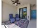 Relaxing outdoor patio with seating and ceiling fan at 6611 Grand Estuary Trl # 105, Bradenton, FL 34212