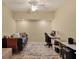 Well-lit room featuring a daybed and a dedicated office space at 6611 Grand Estuary Trl # 105, Bradenton, FL 34212
