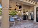 Outdoor tiki bar with ample seating, a lively atmosphere, and a great place for socializing and enjoying refreshments at 6611 Grand Estuary Trl # 105, Bradenton, FL 34212