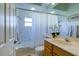 Bright bathroom with a single vanity, a shower/tub combo, and ample counter space at 6619 Copper Ridge Trl, Bradenton, FL 34201