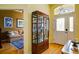 Welcoming entryway with hardwood floors and a glass display cabinet, perfect for showcasing décor at 6619 Copper Ridge Trl, Bradenton, FL 34201