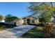 Charming single story home featuring a paved driveway, two-car garage and lush landscaping at 6619 Copper Ridge Trl, Bradenton, FL 34201