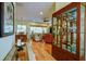 Bright living room featuring hardwood floors, a ceiling fan, and views of the outdoors at 6619 Copper Ridge Trl, Bradenton, FL 34201