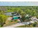 Aerial view of a property, showcasing its landscaping, proximity to water, and building features at 6737 Lincoln Rd, Bradenton, FL 34203
