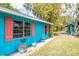 Quaint turquoise home exterior with a charming design and colorful accents at 6737 Lincoln Rd, Bradenton, FL 34203