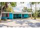Attractive blue house exterior with vibrant red shutters and welcoming front porch at 6737 Lincoln Rd, Bradenton, FL 34203