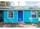 Charming turquoise home with a bright blue door at 6737 Lincoln Rd, Bradenton, FL 34203