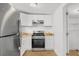 Bright kitchen featuring white cabinets, stainless steel appliances, and a laminate countertop at 6737 Lincoln Rd, Bradenton, FL 34203