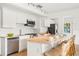 Well-lit kitchen with stainless steel appliances, and seating at a wooden island at 6737 Lincoln Rd, Bradenton, FL 34203