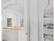 View of the kitchen with white cabinets, butcher block counters, and stainless steel appliances at 6737 Lincoln Rd, Bradenton, FL 34203