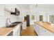 Bright kitchen with butcher block countertops, stainless steel appliances, and white cabinets at 6737 Lincoln Rd, Bradenton, FL 34203