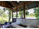 Outdoor structure featuring a sink area with screened walls, offering picturesque views of the nearby waterway at 6737 Lincoln Rd, Bradenton, FL 34203