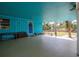 Inviting covered porch featuring a blue door, bench seating, and ample space for relaxing at 6737 Lincoln Rd, Bradenton, FL 34203