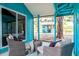 Enclosed porch with comfortable seating and view of the backyard at 6737 Lincoln Rd, Bradenton, FL 34203