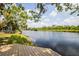 Scenic waterfront view from the deck, showcasing lush greenery and tranquil waters at 6737 Lincoln Rd, Bradenton, FL 34203