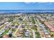 Aerial view of the neighborhood showcasing the property, residential area, and water views in the distance at 6820 19Th W Ave, Bradenton, FL 34209