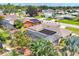 Aerial view of the property showcasing the private screened pool, spacious yard, and solar panels on the roof at 6820 19Th W Ave, Bradenton, FL 34209