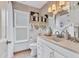 Elegant bathroom featuring white vanity, granite countertop, and decorative accents at 6820 19Th W Ave, Bradenton, FL 34209