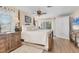 Bright bedroom with wood floors, four-poster bed and large window with exterior view at 6820 19Th W Ave, Bradenton, FL 34209