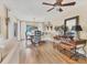 Bright dining room with wood floors, access to outdoor area, and decorative light fixture at 6820 19Th W Ave, Bradenton, FL 34209