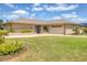 Charming single-story ranch with an attached two-car garage and beautifully manicured lawn at 6820 19Th W Ave, Bradenton, FL 34209