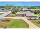 Well maintained single story home featuring manicured landscaping and a long driveway in a residential neighborhood at 6820 19Th W Ave, Bradenton, FL 34209