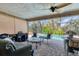 Screened patio with ample seating overlooking the pool and lush landscaping at 6820 19Th W Ave, Bradenton, FL 34209