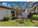 Well-manicured backyard with lush greenery and a privacy fence at 6946 Woodwind Dr # 2, Sarasota, FL 34231