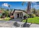 Charming single-story home with a covered parking area and lush tropical landscaping at 6946 Woodwind Dr # 2, Sarasota, FL 34231