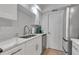 Modern kitchen with white cabinets, stainless steel appliances and subway tile backsplash at 6946 Woodwind Dr # 2, Sarasota, FL 34231