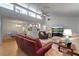 Open-concept living room with high ceilings, tile floors and adjoined to kitchen and dining room at 6946 Woodwind Dr # 2, Sarasota, FL 34231