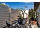 Private outdoor patio with table and chairs, perfect for relaxing or entertaining at 6946 Woodwind Dr # 2, Sarasota, FL 34231