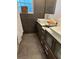 Contemporary bathroom with double vanity, sleek fixtures, and tiled shower, offers a spa-like experience at 7036 Clark Rd, Sarasota, FL 34241