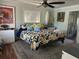 Tranquil bedroom with stylish bedding, soft lighting, and ample closet space, provides a peaceful retreat at 7036 Clark Rd, Sarasota, FL 34241