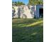 An exterior view of a metal building with surrounding lawn at 7036 Clark Rd, Sarasota, FL 34241
