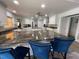 Modern kitchen boasts granite countertops, stainless steel appliances, and ample cabinet space, perfect for cooking at 7036 Clark Rd, Sarasota, FL 34241