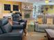 Comfortable living room features a fireplace, plush seating, and bright decor, perfect for relaxing and entertaining at 7036 Clark Rd, Sarasota, FL 34241