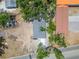 An aerial view highlights the property's roof and surrounding tree-lined neighborhood at 732 15Th E St, Bradenton, FL 34208