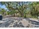 Expansive backyard featuring mature trees, providing shade and privacy at 732 15Th E St, Bradenton, FL 34208