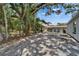 Large, undeveloped backyard with mature trees offers plenty of space for recreation and relaxation at 732 15Th E St, Bradenton, FL 34208