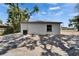Back exterior view with white siding, black trim, and a visible window and AC unit at 732 15Th E St, Bradenton, FL 34208