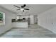 Inviting open concept space blends living and dining with bright kitchen and modern stainless steel appliances at 732 15Th E St, Bradenton, FL 34208