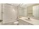 Clean bathroom featuring a tub and shower combination, a vanity with a sink, and a large mirror at 7687 Sweetbay Cir # 7687, Bradenton, FL 34203