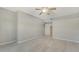 Bright, carpeted bedroom featuring a ceiling fan and ensuite access at 7687 Sweetbay Cir # 7687, Bradenton, FL 34203