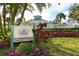 The Preserve at Tara community center framed by colorful flowers and landscaping at 7687 Sweetbay Cir # 7687, Bradenton, FL 34203