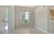 Bright dining room featuring tile floors, neutral walls, and a classic light fixture at 7687 Sweetbay Cir # 7687, Bradenton, FL 34203