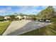 Exterior of community clubhouse and a row of golf carts on a sunny day at 7687 Sweetbay Cir # 7687, Bradenton, FL 34203