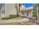 Exterior of condo building with a well maintained walkway and landscaping at 7687 Sweetbay Cir # 7687, Bradenton, FL 34203