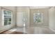 Bright foyer with tile floors, a front door, and sunlit windows at 7687 Sweetbay Cir # 7687, Bradenton, FL 34203